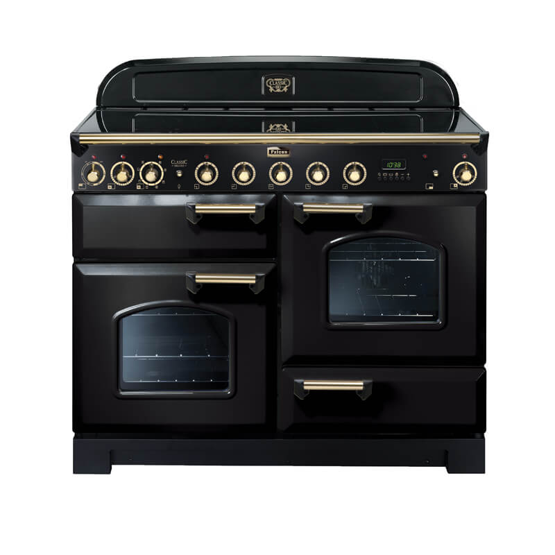 Falcon Classic Deluxe CDL110EIBL-BR 110cm Black & Brass Induction Range Cooker in a modern kitchen, showcasing its freestanding design with sleek black finish and brass accents.