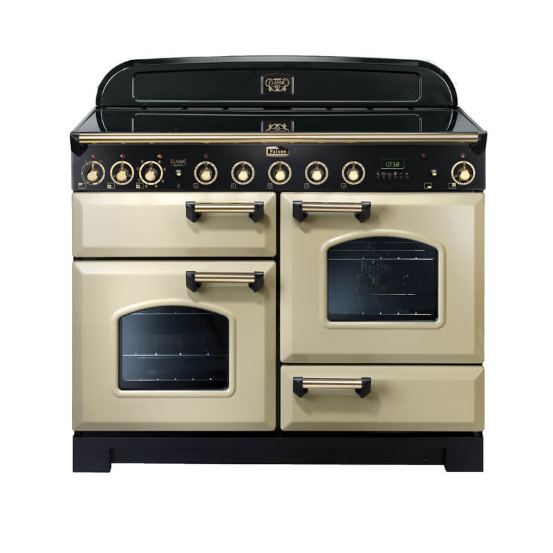 Falcon Classic Deluxe CDL110EICR-BR 110cm cream and brass induction range cooker with a stainless steel finish, freestanding design, and multiple cooking zones.