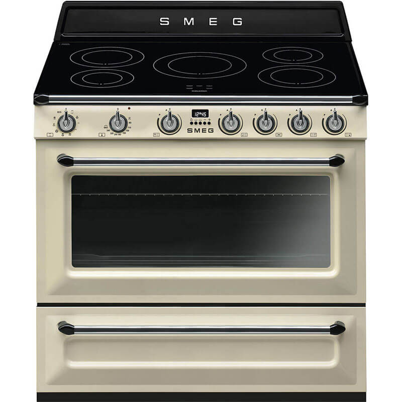 Smeg Victoria 90cm Cream Induction Freestanding Cooker (TR90IP2) with retro design and stainless steel accents in a stylish kitchen setting.