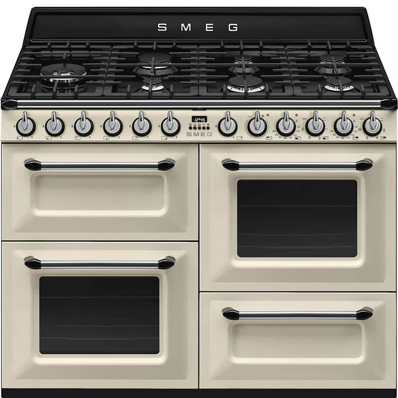 Smeg Victoria Cream Dual Fuel Gas Hob Freestanding Cooker (TRA4110P) in a kitchen setting, featuring a traditional design with multiple oven compartments, six gas burners, and cream-colored exterior.