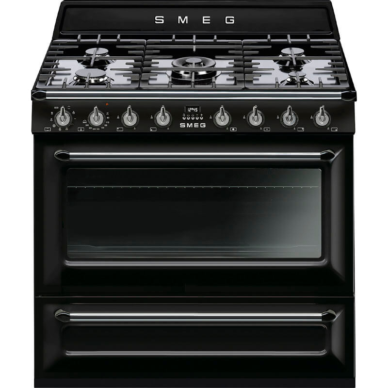 A sleek black Smeg Victoria Dual Fuel Gas Hob Pyro Oven Freestanding Cooker (model TRA90BLP2) displayed in a modern kitchen setting, showcasing its stylish design and user-friendly controls.