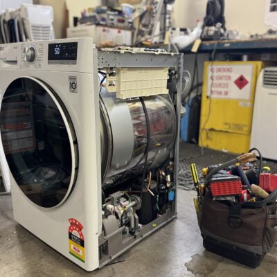 Technician repairing clothes dryer for clothes dryer repairs Adelaide